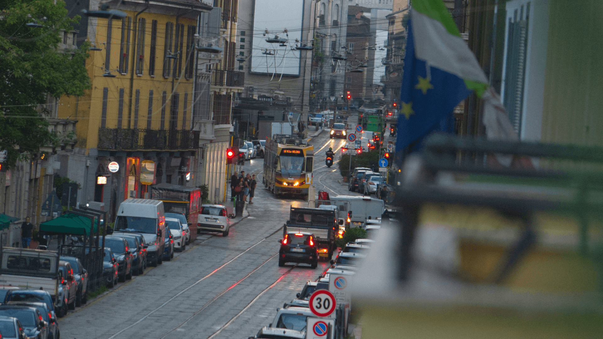 Urban streetscape in a European city with cars and trams
