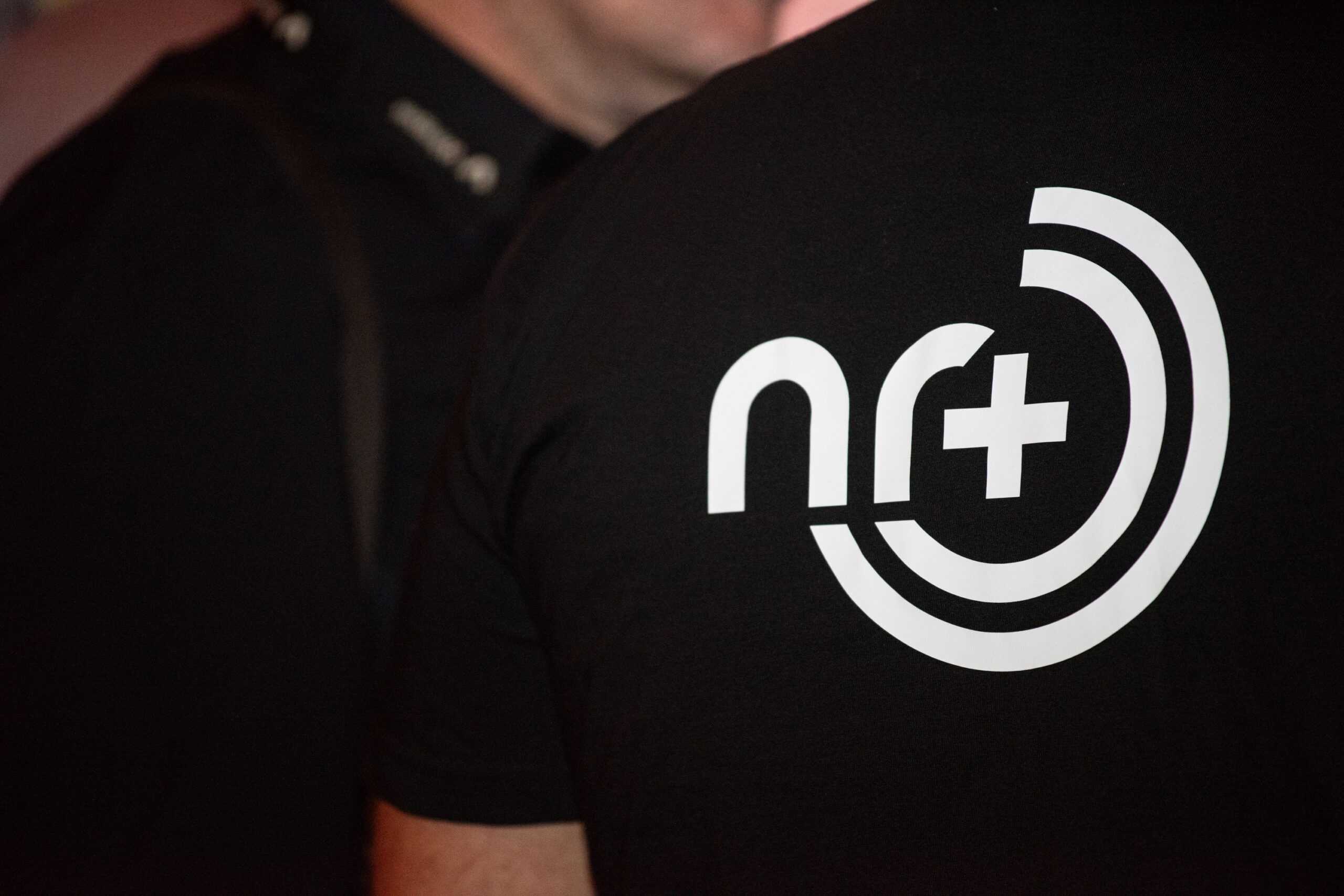 Image of the back of a t-shirt that has the NR+ logo. NR+ is the new global non-cellular 5G connectivity standard.
